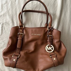 Michael Kors leather satchel/purse brown in color with wallet.